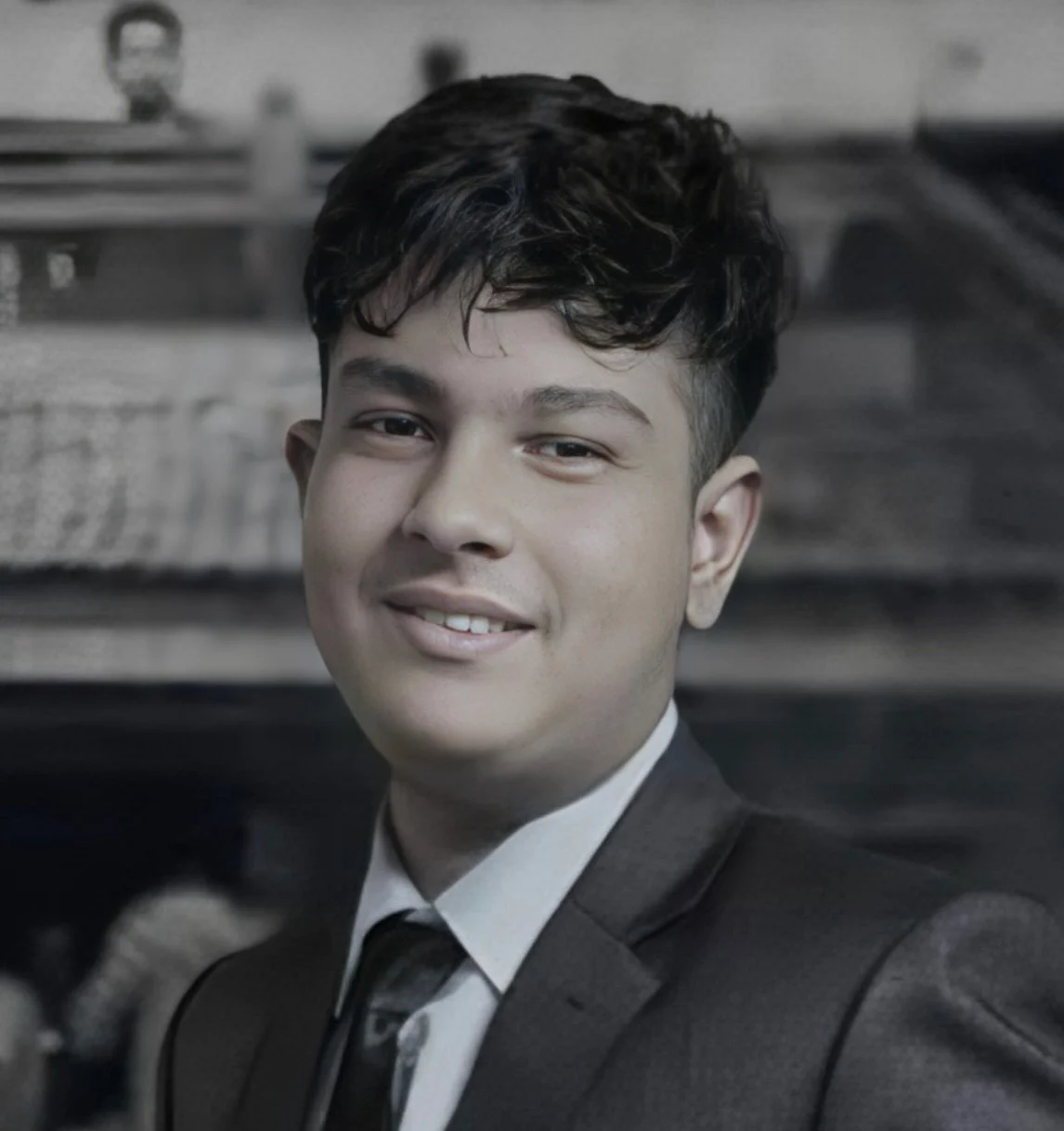 Professional headshot of Adarsha Dhakal