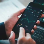 Investor analyzing stock risk and market trends on financial charts to make smarter investment decisions featured on Novozora.