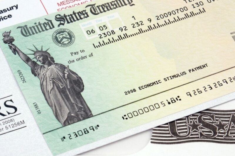 A person checking their IRS refund status on a smartphone for May 2026.